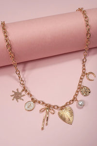 Gold Charm Necklace | Sun Bow Pearl Cross