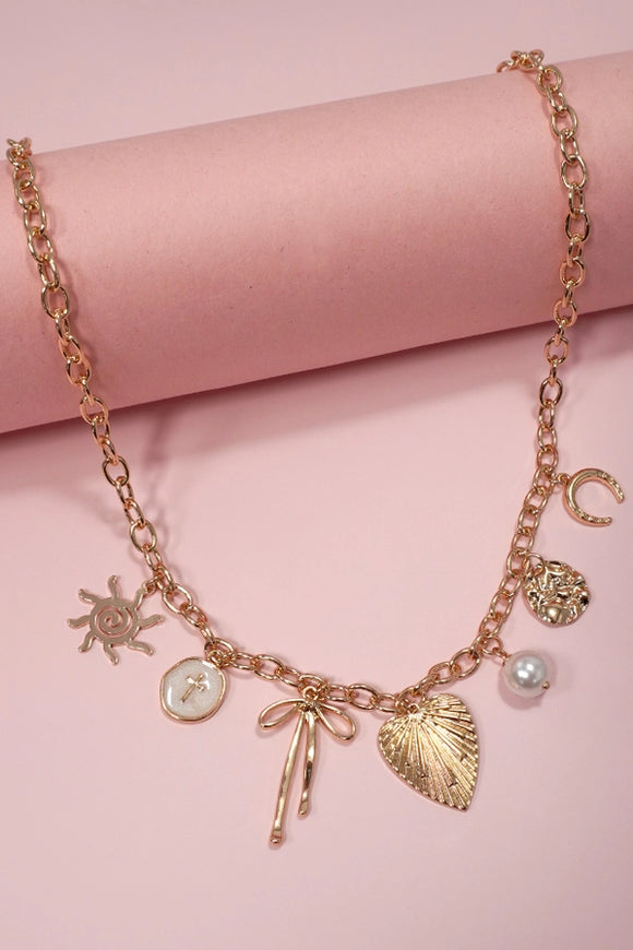 Gold Charm Necklace | Sun Bow Pearl Cross