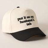 Put It On My Husband's Tab Trucker Cap | Black