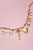 Gold Charm Necklace | Sun Bow Pearl Cross