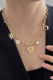 Gold Charm Necklace | Sun Bow Pearl Cross
